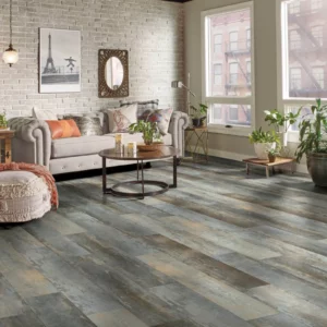 Gray multi tone luxury vinyl plank flooring in a living room | Coleman's Flooring & Blinds