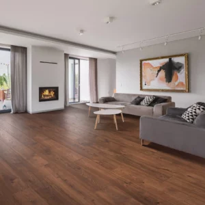 Warm wood-look laminate flooring in living room | Coleman's Flooring & Blinds