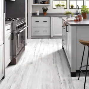 Gray luxury vinyl flooring in a kitchen | Coleman's Flooring & Blinds